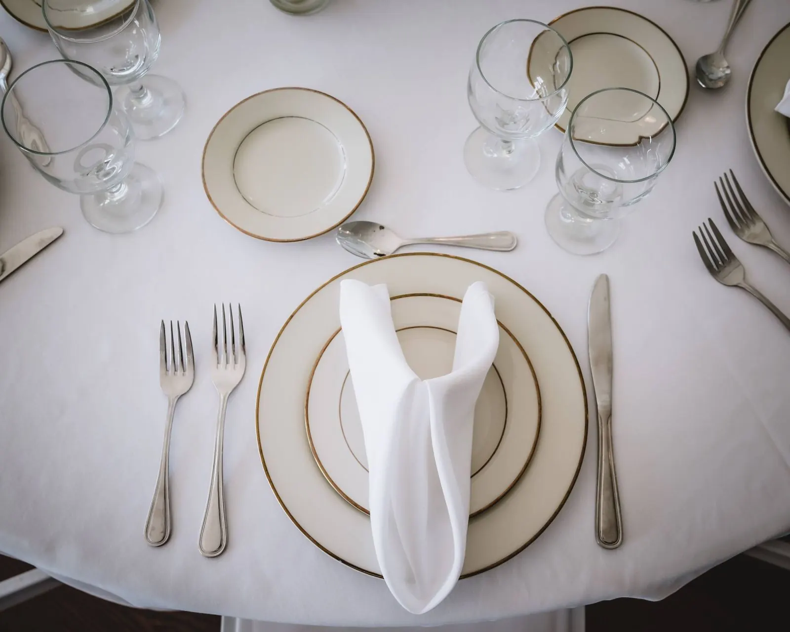 Simple place setting on a white tablecloth